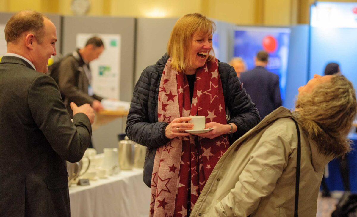 Pharmacists laughing with each other at a UKCPA event